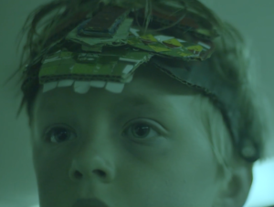 close up of s child's head wearing a headband
